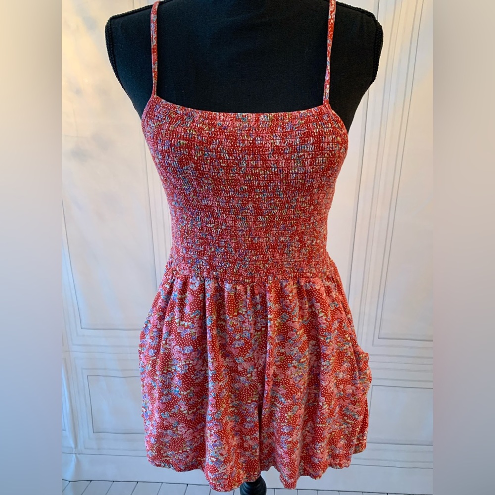 Boutique patterned romper with pockets and adjustable straps